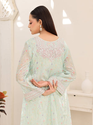 Wide embroidered cuffs on mint organza dress