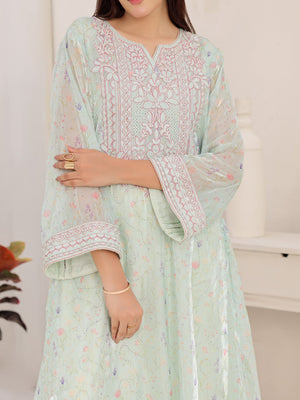 Wide embroidered cuffs on mint organza dress