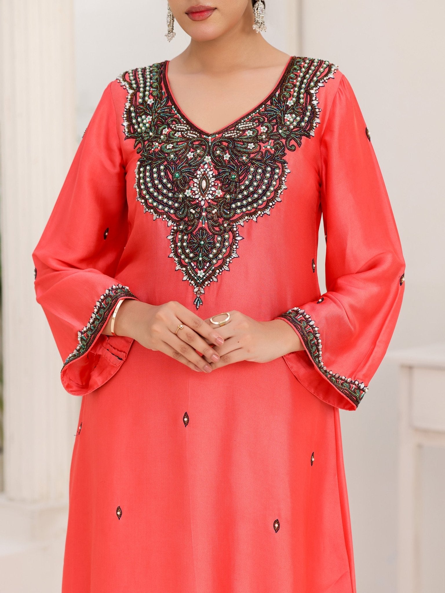 Coral Noir glass-silk dress with crystal-embellished neckline and embroidered cuffs